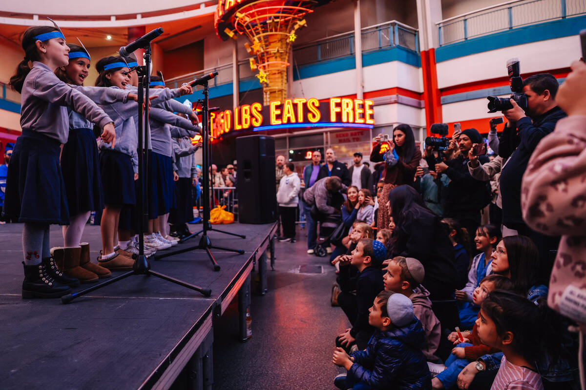 Children from the Desert Torah Academy sing during the Fremont Street Experience menorah lighti ...
