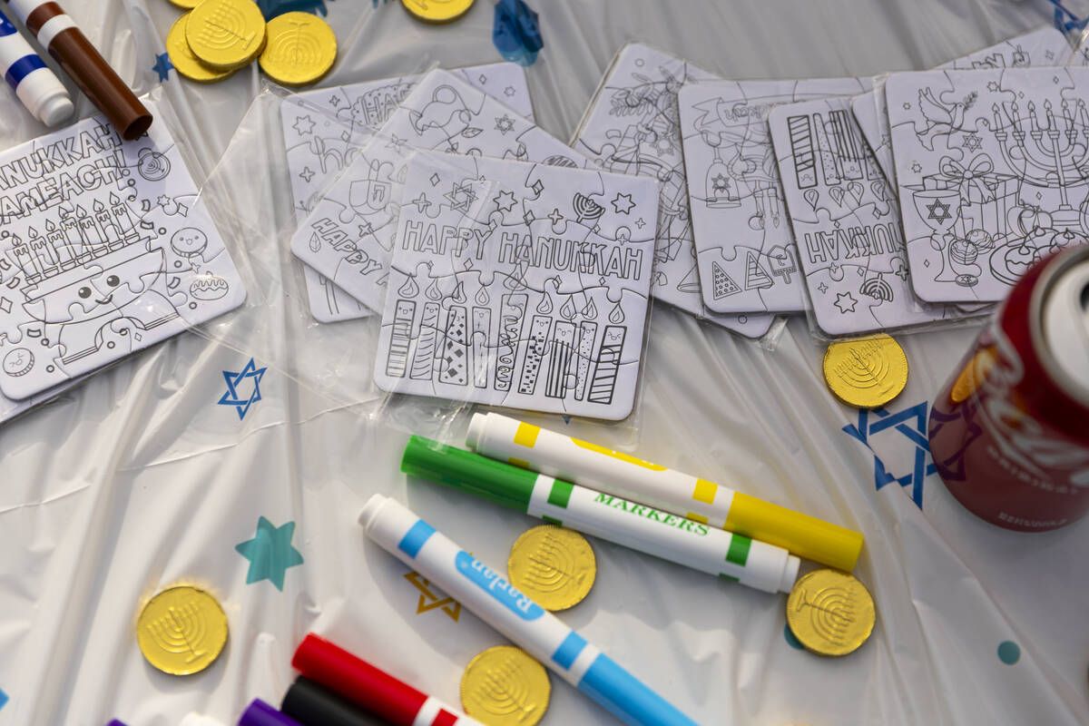 Puzzles and drawing materials for children are seen during a pre-Hanukkah family event at Zucke ...