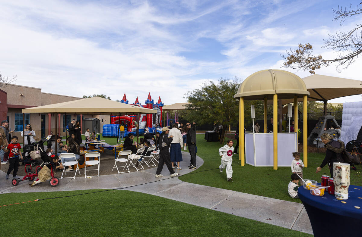 People attend a pre-Hanukkah family event at Zucker Jewish Academy on Sunday, Dec. 14, 2025, in ...