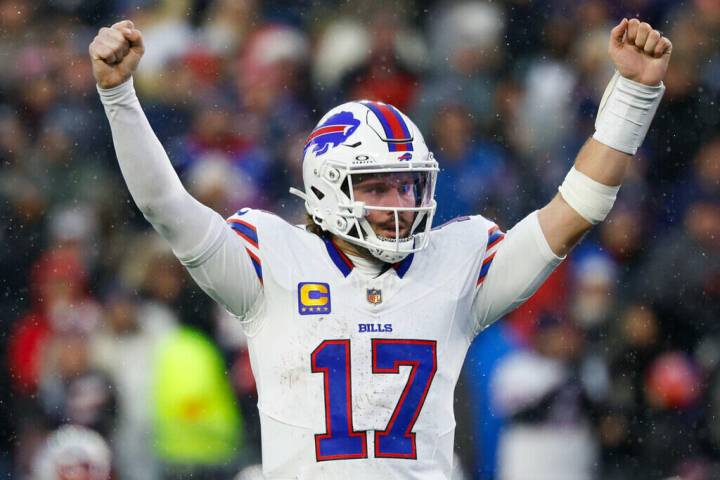 Buffalo Bills quarterback Josh Allen (17) reacts after throwing a touchdown during the second h ...