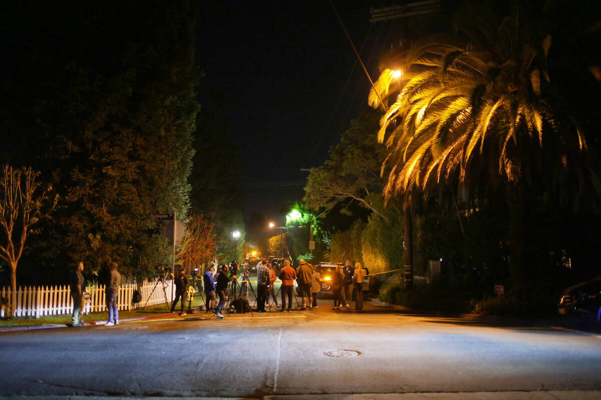 News media gather near Rob Reiner's residence Sunday, Dec. 14, 2025, in the Brentwood sect ...