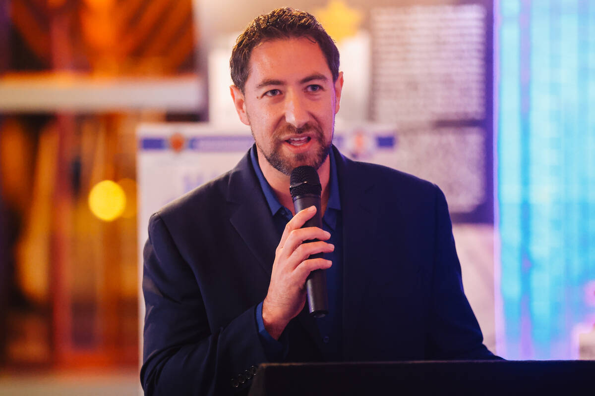 Commissioner Michael Naft speaks during an event for the second night of Hanukkah at the Clark ...