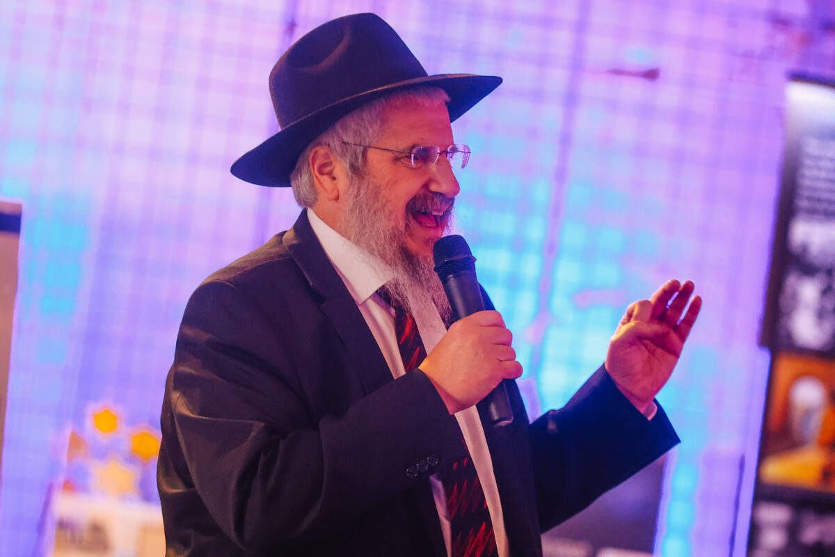 Rabbi Shea Harlig speaks during an event for the second night of Hanukkah at the Clark County G ...