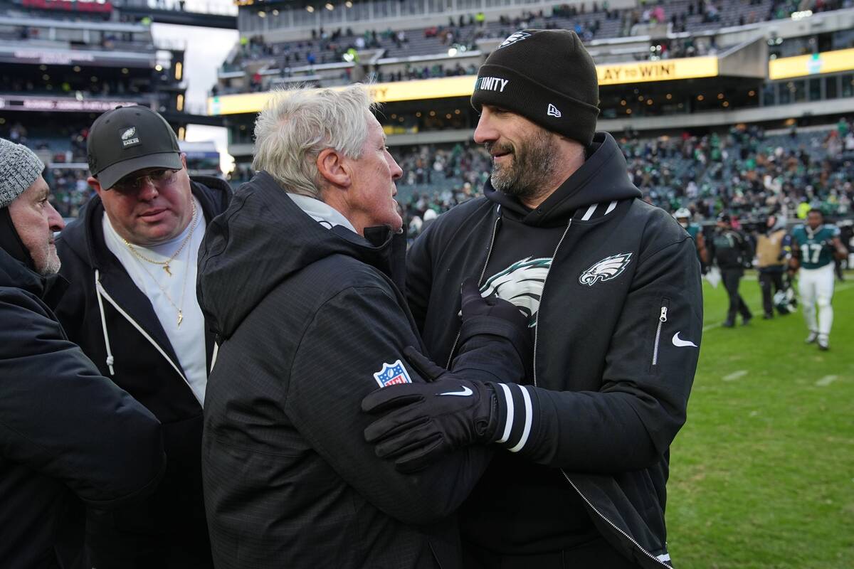Philadelphia Eagles head coach Nick Sirianni, right, greets Las Vegas Raiders head coach Pete C ...