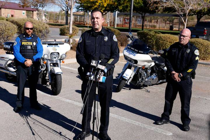 The Henderson Police Department Capt. Seth VanBeveren, flanked by Officer Jake Frampton, left, ...