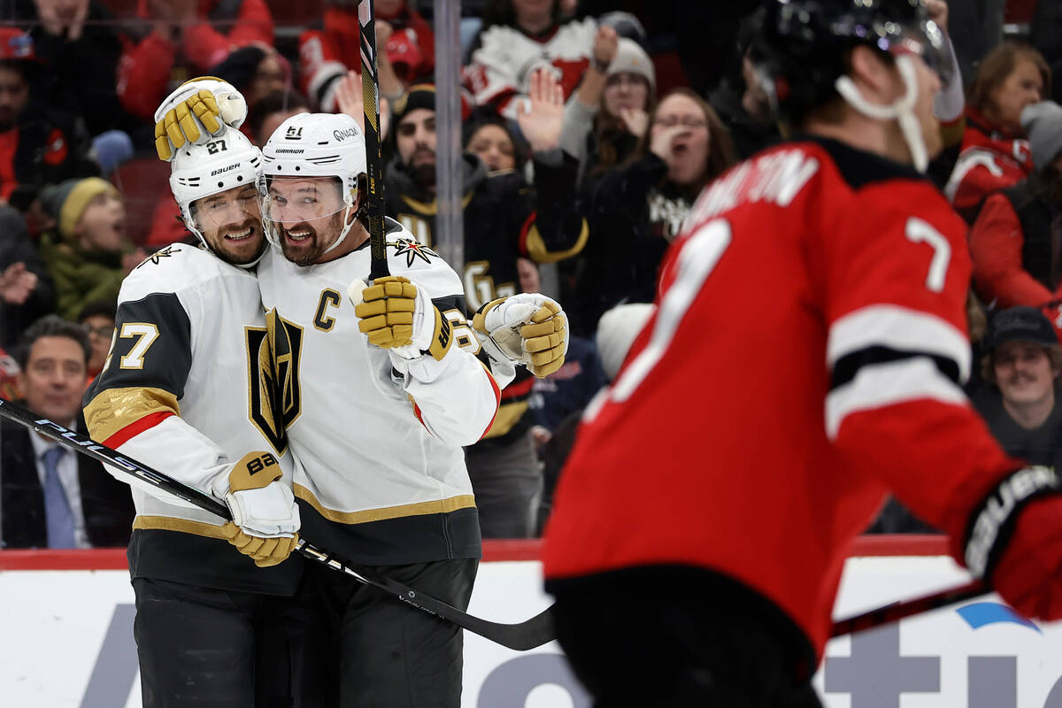 Vegas Golden Knights defenseman Shea Theodore (27) is congratulated after scoring a goal by Mar ...