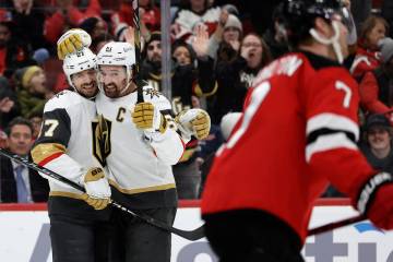 Vegas Golden Knights defenseman Shea Theodore (27) is congratulated after scoring a goal by Mar ...
