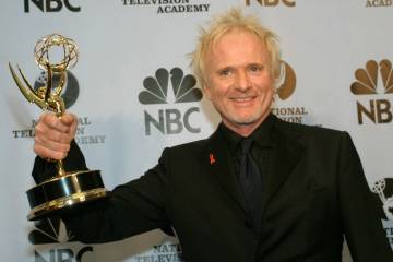 Anthony Geary holds up his Emmy as poses for photographers after winning "Outstanding Lead Acto ...
