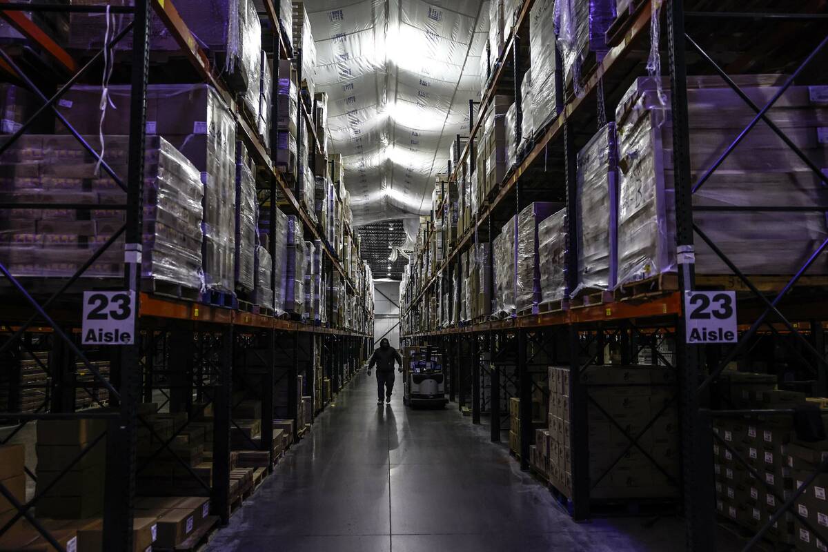 A forklift driver navigates a massive cooling warehouse at CCSD’s Central Kitchen Thursd ...