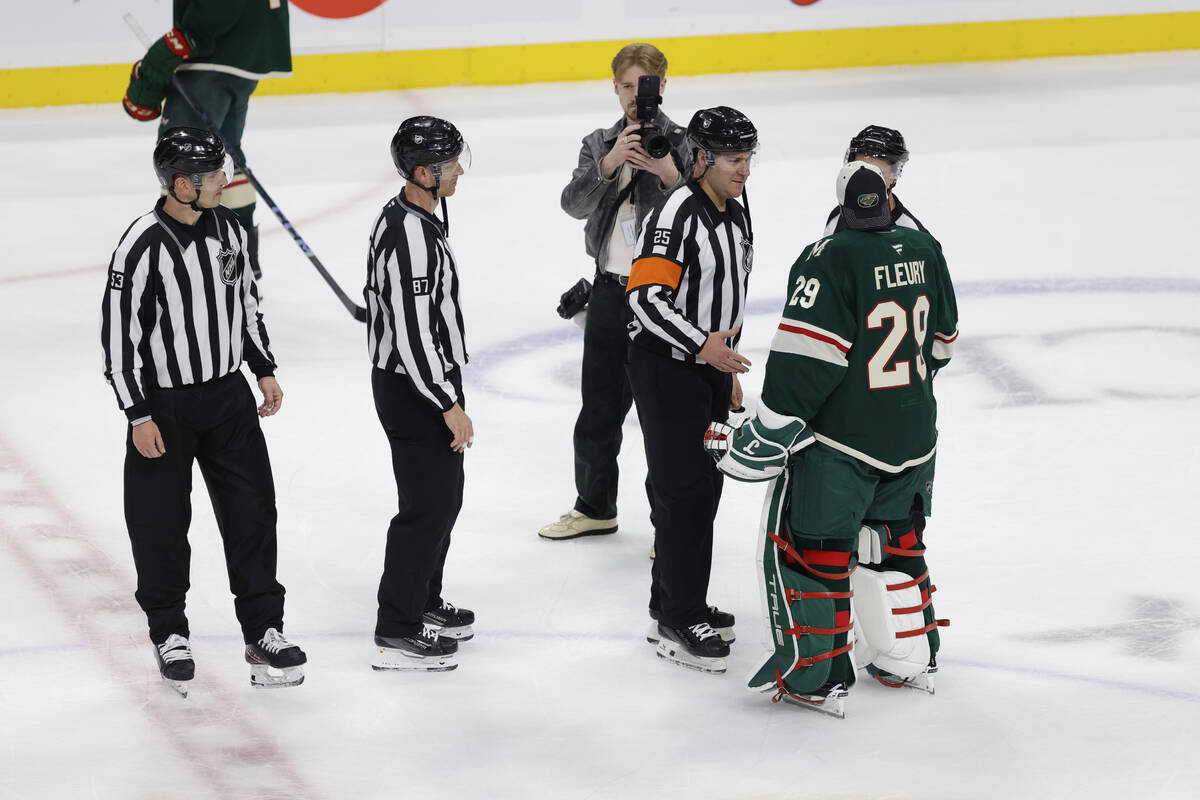 Minnesota Wild goaltender Marc-Andre Fleury (29) shakes hands with the referees after Game 6 of ...