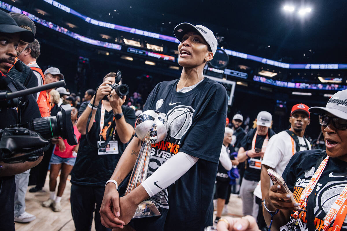 Aces center A'ja Wilson celebrates winning the WNBA championship following game four of a ...