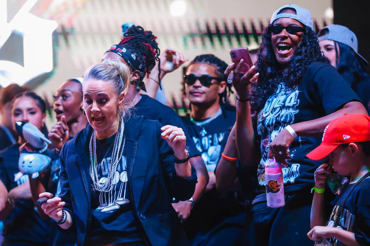 Aces head coach Becky Hammon celebrates during the Aces’ championship parade on the Stri ...