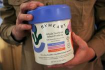 Stephen Dexter holds a container of ByHeart baby formula, which was recently recalled by ByHear ...