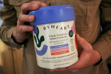 Stephen Dexter holds a container of ByHeart baby formula, which was recently recalled by ByHear ...