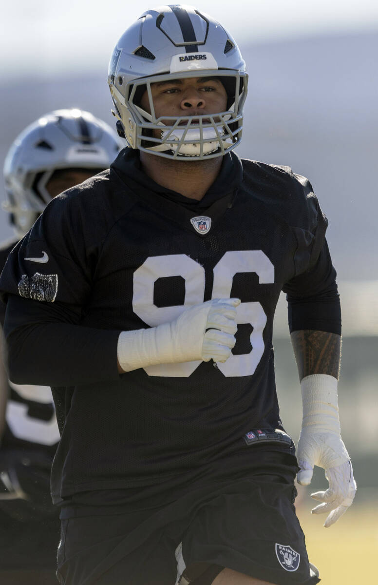 Raiders defensive tackle Jonah Laulu (96) runs during the team’s practice at the Intermo ...