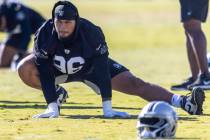 Raiders defensive tackle Jonah Laulu (96) stretches during the team’s practice at the In ...