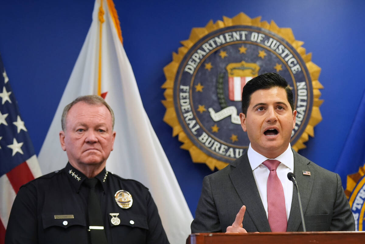 First Assistant United States Attorney Bill Essayli, right, speaks in front of LAPD Chief Jim M ...
