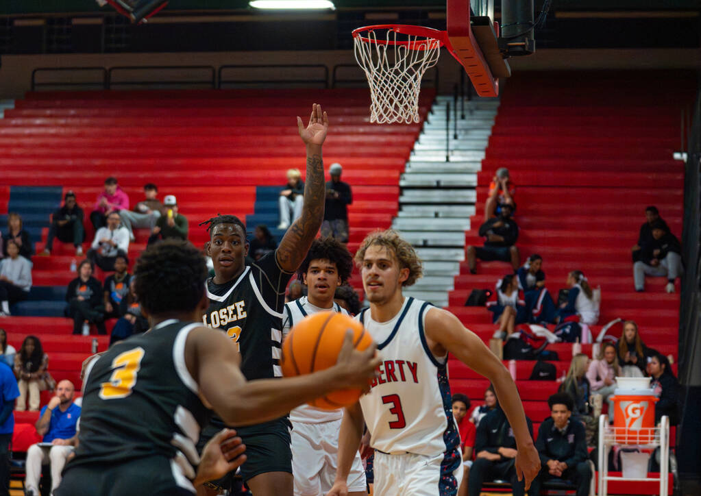 Losee guard De'Montae Edwards (3) looks for his next move during a basketball game at Libe ...