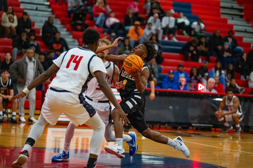 Losee point guard DJ Hunter (1) takes a layup during a basketball game at Liberty High School i ...