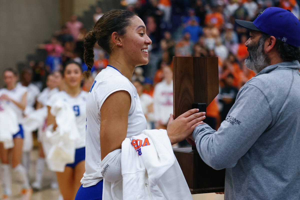 Bishop Gorman outside hitter Ayanna Watson receives the trophy after the Gaels’ win over ...