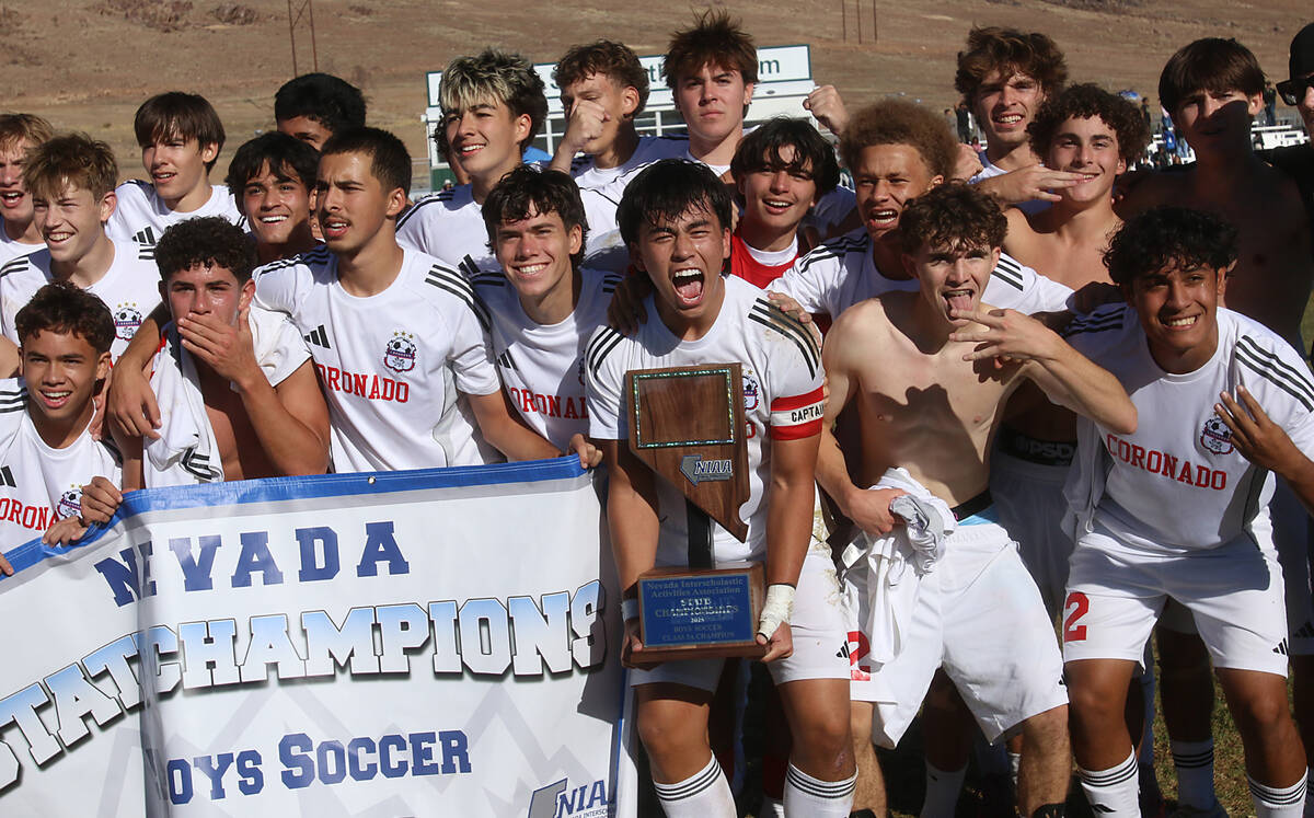 Coronado players celebrate after defeating Hug 2-1 to win the NIAA 5A state championship soccer ...