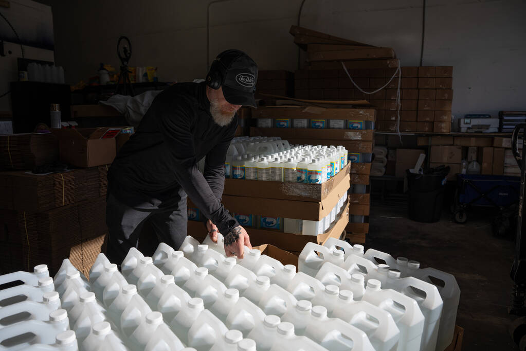 Nicola Costagliola organizes pallets of Stingray spot removing cleaner for distribution at a wa ...