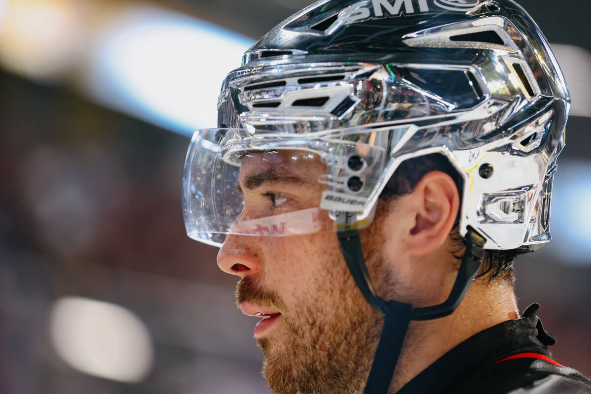 Silver Knights forward Tanner Laczynski (28) helps shovel piles of toys on the rink during a ga ...