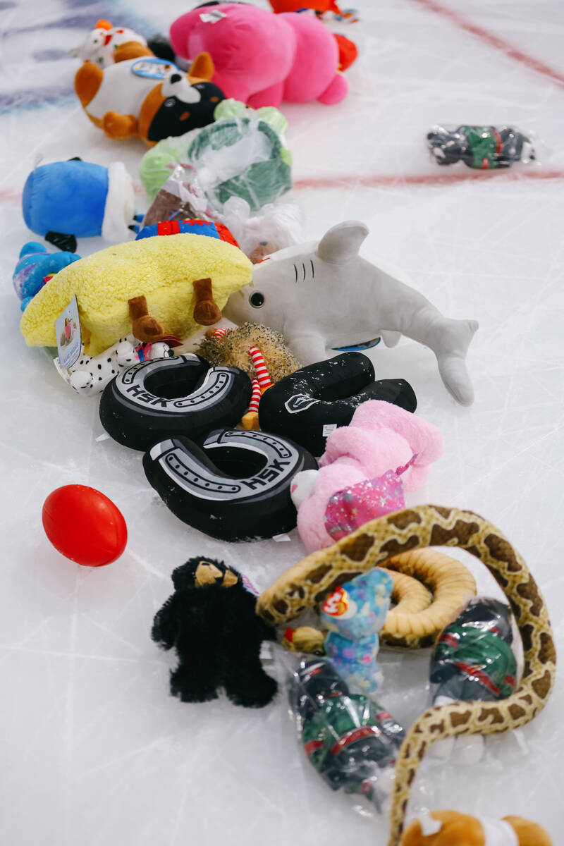 Piles of toys lay on the ice after Lucky Launch during a game between the Silver Knights and th ...