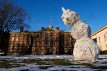A snowman begins to sag on the usually-bustling Main Green at Brown University, where the fall ...