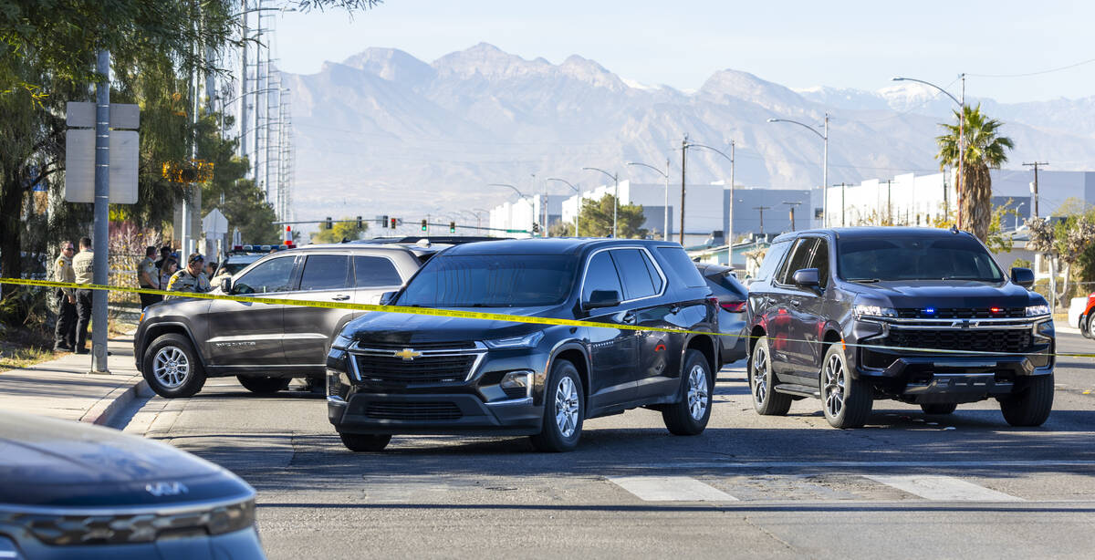Vehicles are parked in the street as Metropolitan Police Department officers along with North L ...
