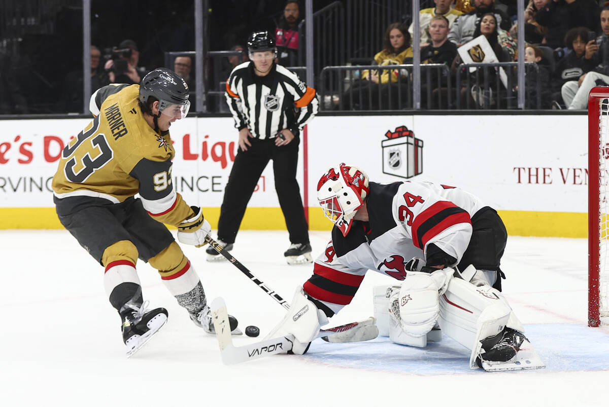 Golden Knights right wing Mitch Marner (93) hits the puck with his skate during a shootout agai ...