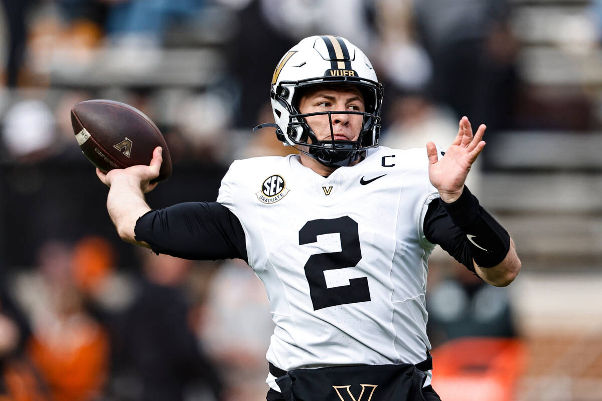 Vanderbilt quarterback Diego Pavia (2) throws to a receiver during warmups beforean NCAA colleg ...