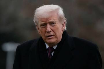 President Donald Trump looks over after stepping off Marine One on the South Lawn of the White ...
