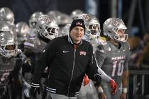 UNLV's head football coach Dan Mullen takes the field against Nevada at Mackay Stadium on ...