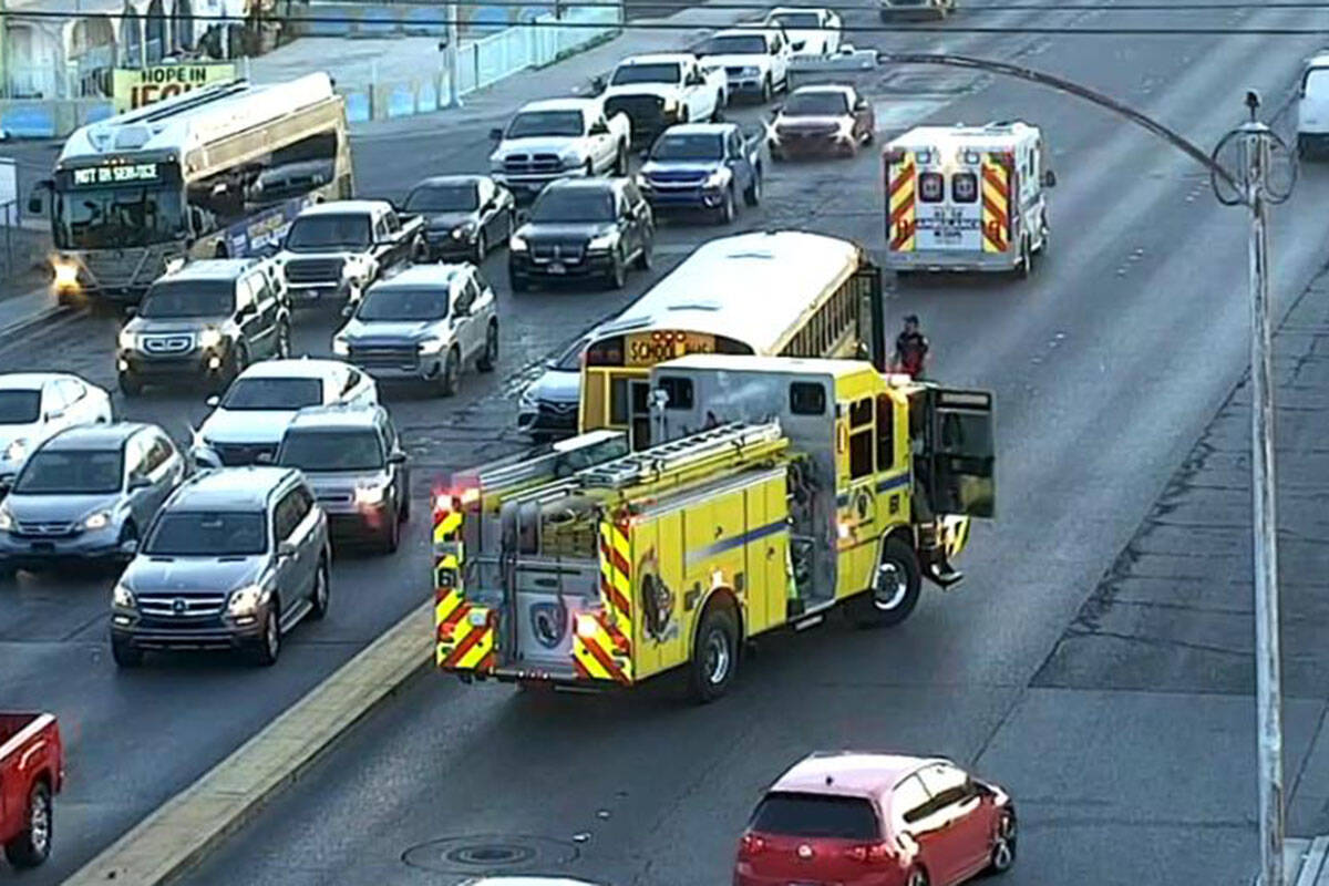 Police investigate a two-vehicle crash involving a school bus Thursday, Dec. 18, 2025, on East ...