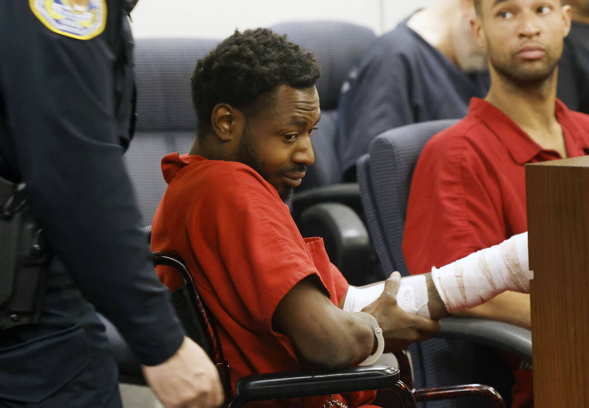 Avyonte Webb, who was shot by Henderson police officers, is led into a court room during a stat ...