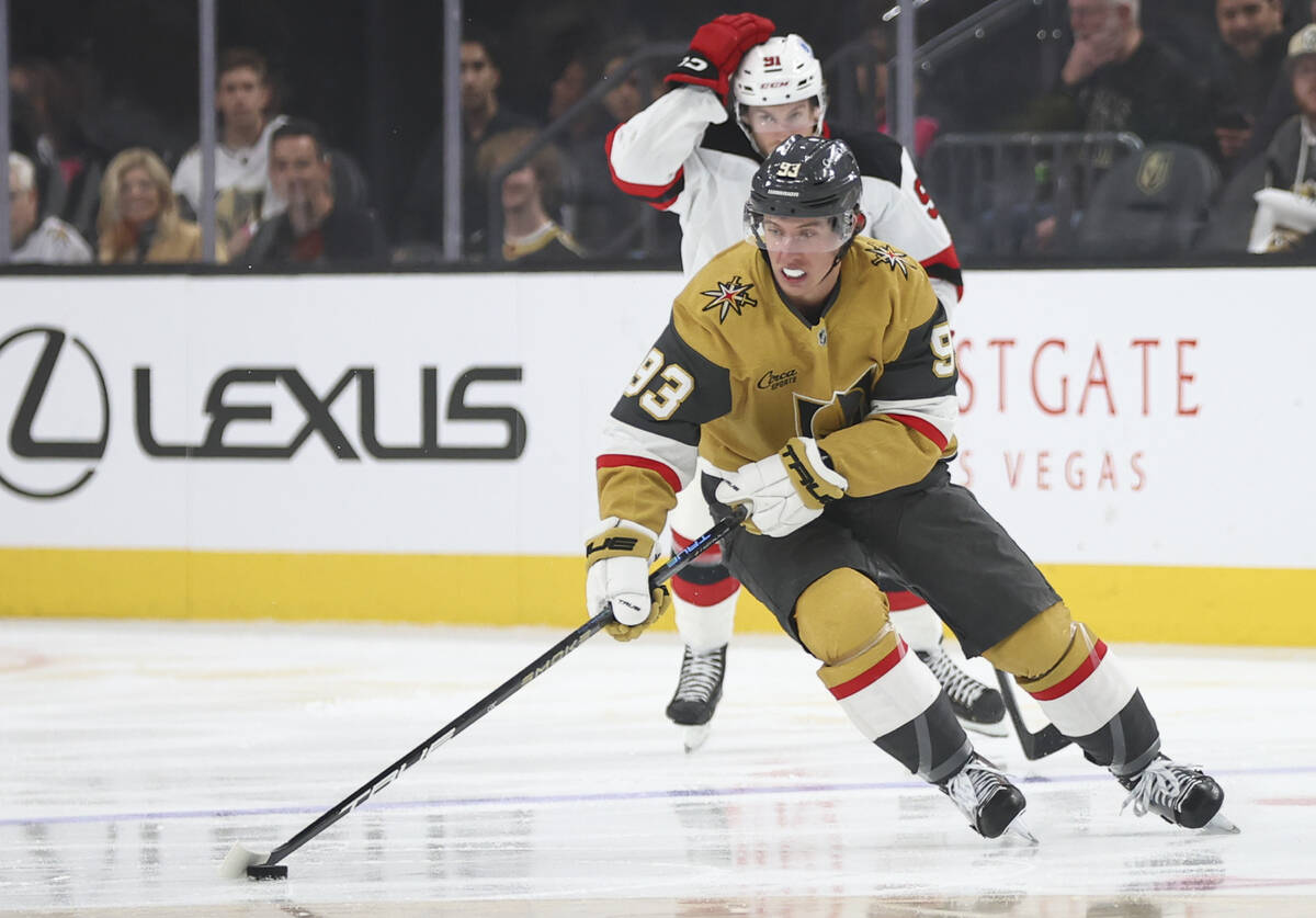 Golden Knights right wing Mitch Marner (93) skates with the puck during the first period of an ...