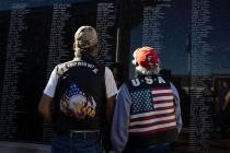 U.S. Army veteran Paul Martinez, 64, left, and retired Army National Guard Teofilo, 66, watch t ...