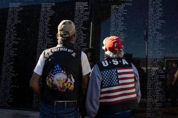 U.S. Army veteran Paul Martinez, 64, left, and retired Army National Guard Teofilo, 66, watch t ...