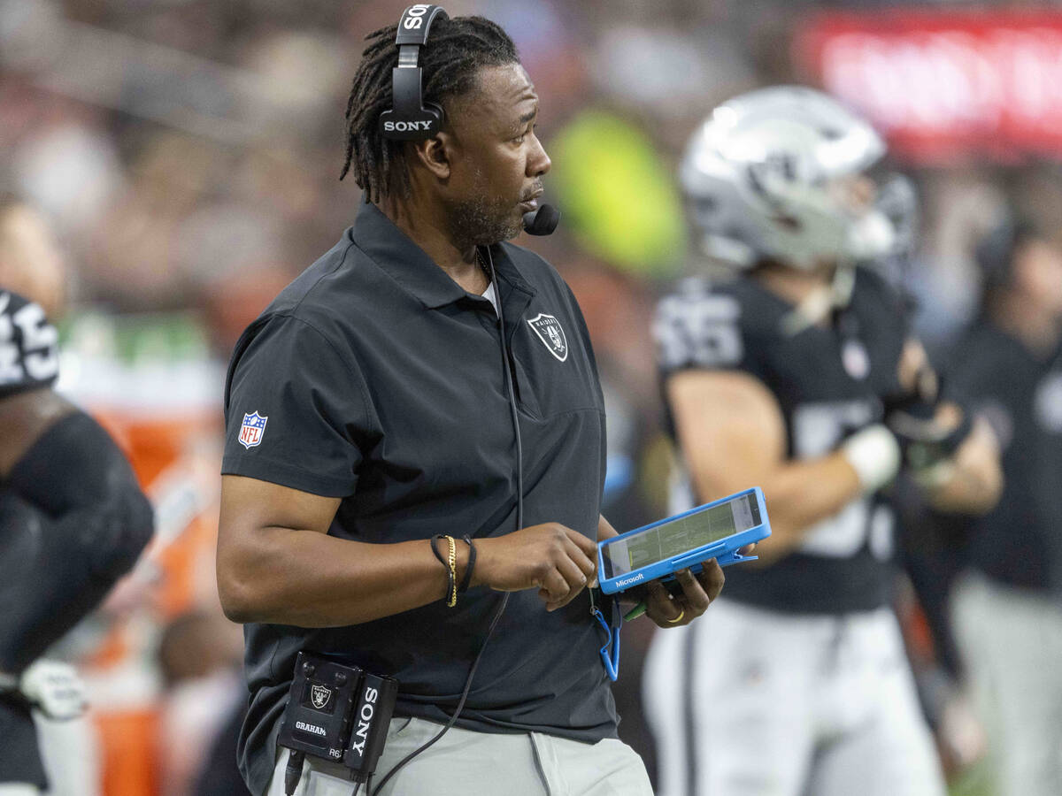 Raiders defensive coordinator Patrick Graham watches the team play against the Denver Broncos d ...