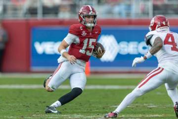 Alabama quarterback Ty Simpson (15) runs the ball against Oklahoma during the first half of an ...
