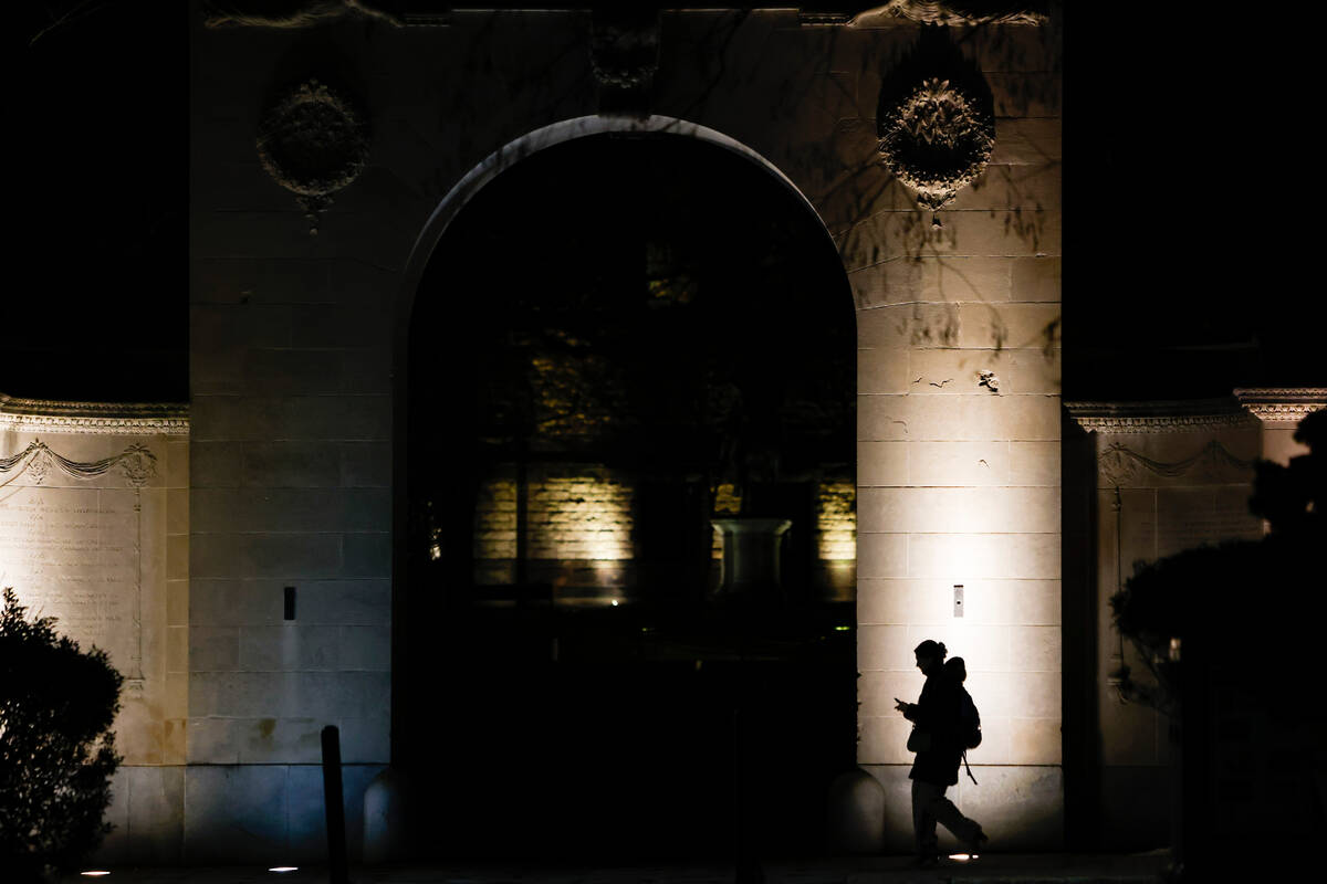 A pedestrian walks along Brown University's campus on Thayer St. in Providence, R.I., Wedn ...