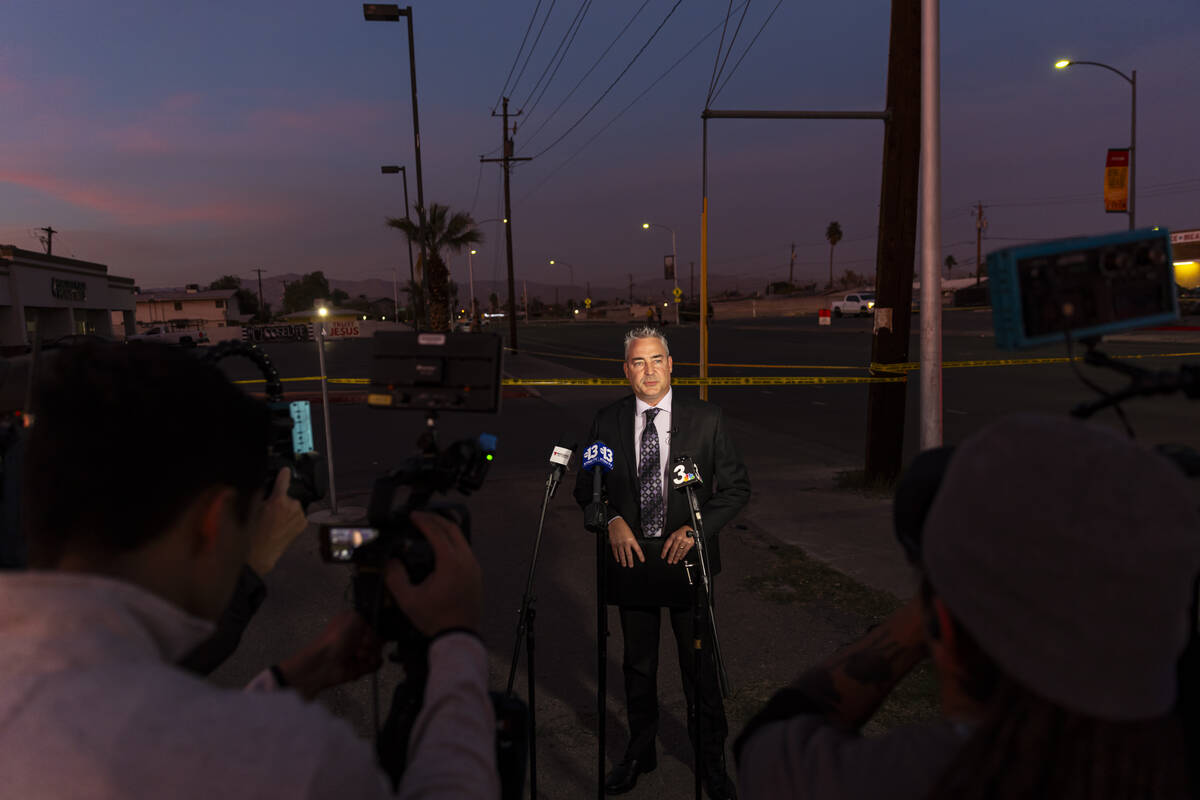 Metropolitan Police Department Lt. Robert Price speaks as officers investigate the scene where ...