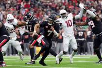 Houston Texans quarterback C.J. Stroud (7) runs away from the pressure by Arizona Cardinals lin ...