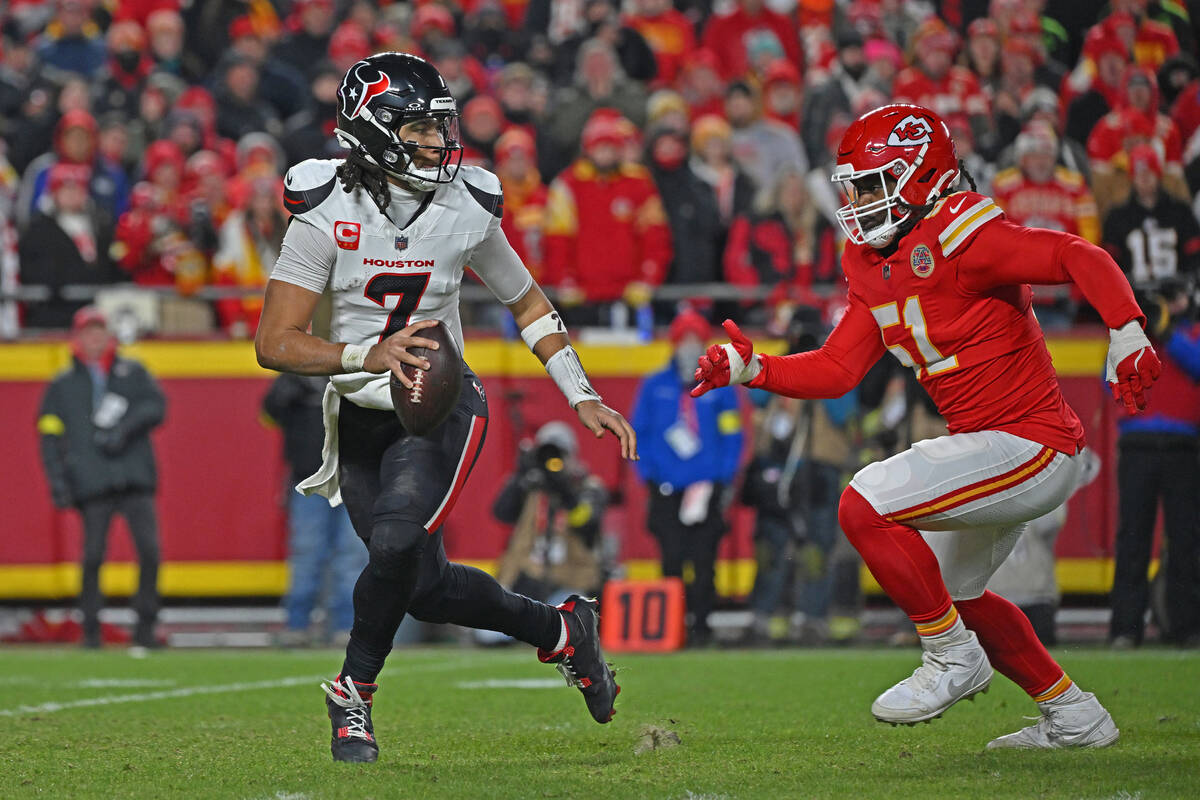 Houston Texans quarterback C.J. Stroud (7) scrambles away from pressure form Kansas City Chiefs ...