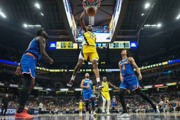 Indiana Pacers forward Isaiah Jackson (22) dunks in front of New York Knicks forward Pacome Dad ...