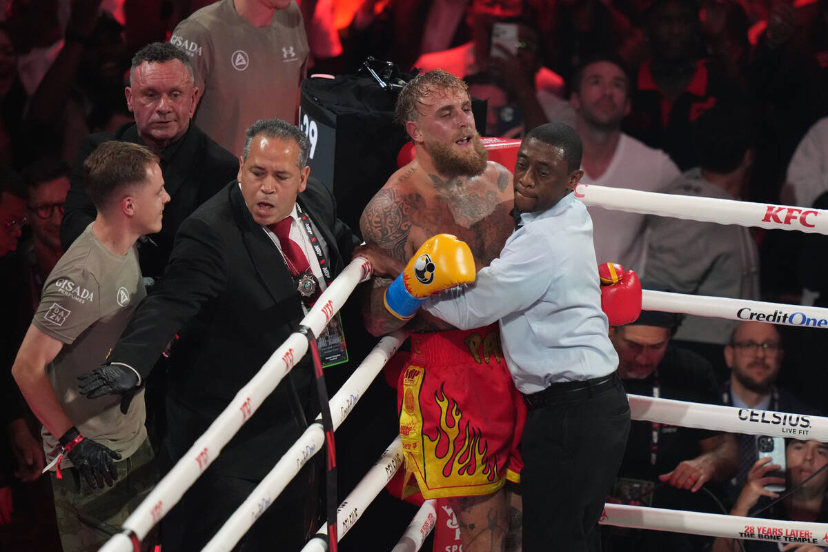 Jake Paul reacts in the corner of the ring during the heavyweight boxing match against Anthony ...