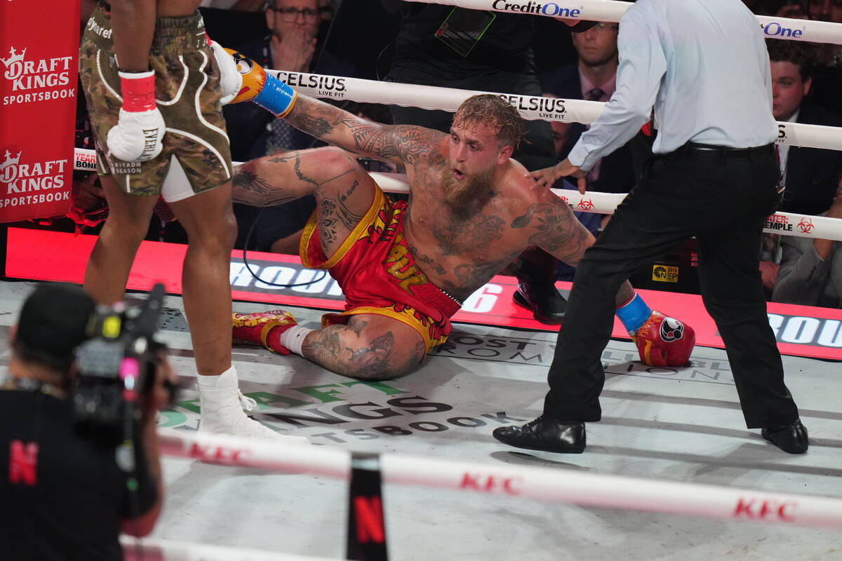 Jake Paul falls on the canvas after being hit by Anthony Joshua during their heavyweight boxing ...