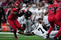 Houston Texans cornerback Derek Stingley Jr., left, returns an interception thrown by Las Vegas ...