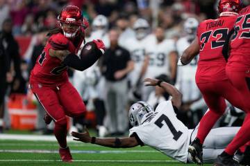 Houston Texans cornerback Derek Stingley Jr., left, returns an interception thrown by Las Vegas ...